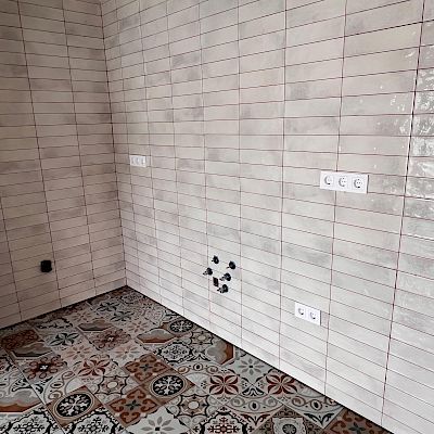 Professionally done tiled surfaces in a kitchen area.