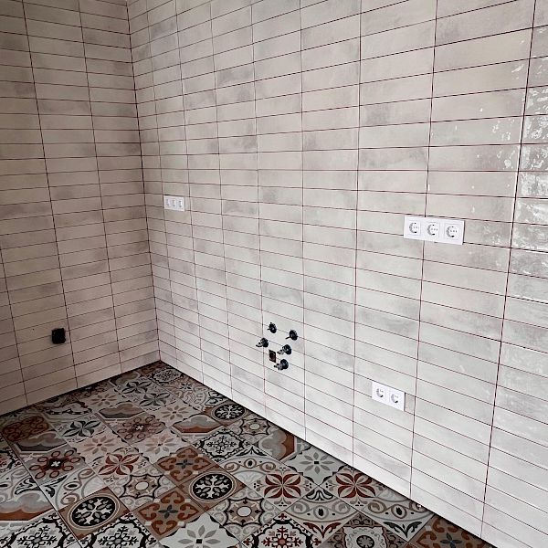 Professionally done tiled surfaces in a kitchen area.